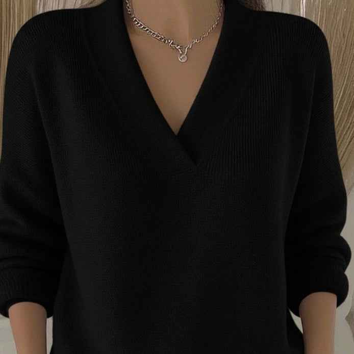 Women’s Soft V-Neck Loose Knit Sweater – Casual Autumn & Winter Pullover in black color worn by a model.